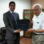 Presenting the FES book to Kapil Sibal